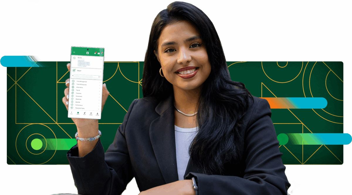 A Paycom developer with brown hair smiles holding a phone showing the Paycom mobile app.