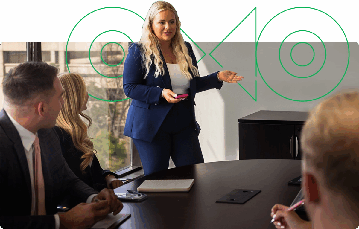 A blonde, Paycom sales team member in striped jacket smiles.