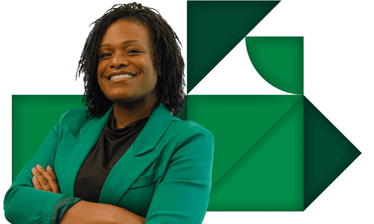 Man with glasses and goatee stands next to woman wearing black with arms crossed and smiling.